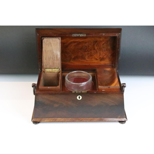 149 - William IV mahogany sarcophagus tea caddy, with twin loop handles, the lid opening to a pair of remo... 