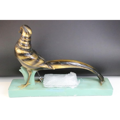 151 - Art Deco style moulded plaster figure of a golden pheasant, with menu / photograph holder metal fitt... 