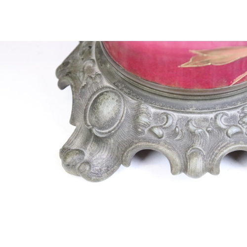 152 - An antique oil lamp having floral decoration to base and opaque shade and scrolled feet. Measures ap... 