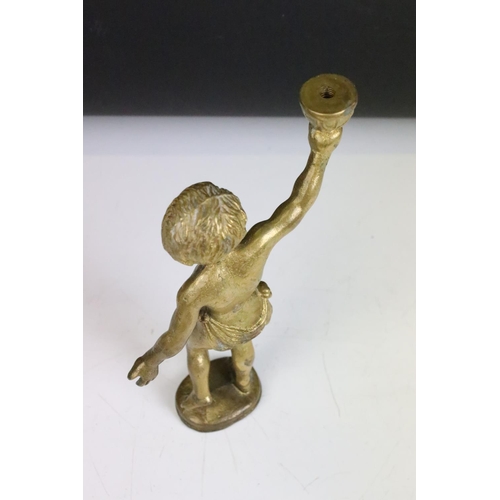 158 - Pair of brass cherub lamp fittings. Measure approx 22cm high