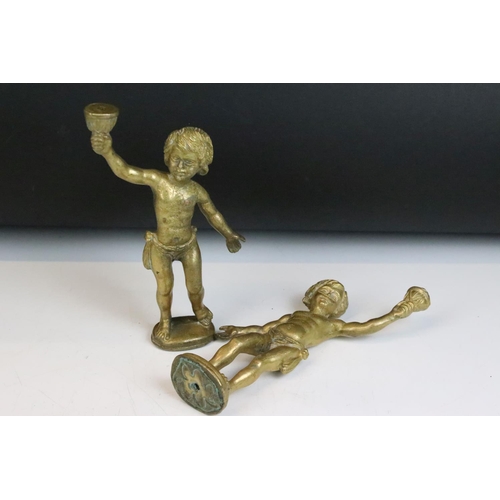 158 - Pair of brass cherub lamp fittings. Measure approx 22cm high