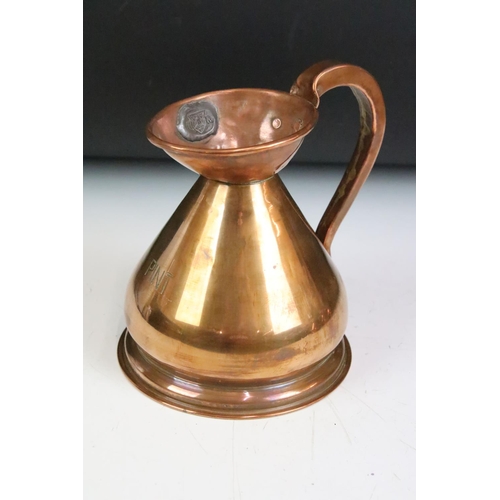 172 - A set of four copper graduated copper jugs from 1/2 Gill through to 1 Pint, proof marks to jugs rims... 