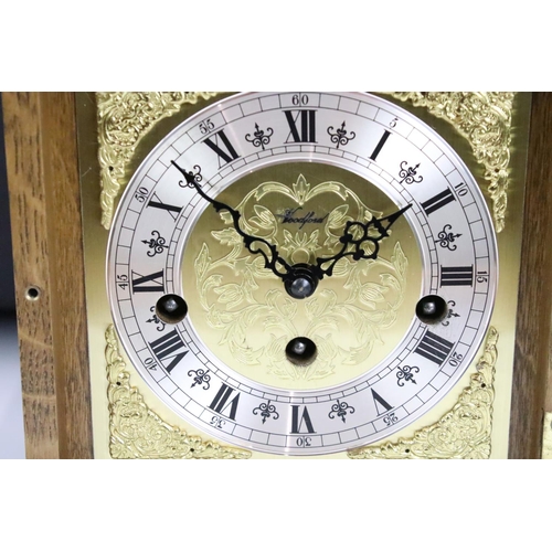 173 - Oak cased Woodford bracket clock, the brass dial with silvered chapter ring, glazed front door, bras... 