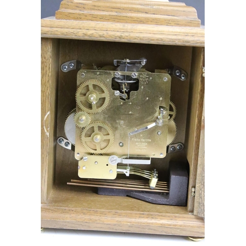 173 - Oak cased Woodford bracket clock, the brass dial with silvered chapter ring, glazed front door, bras... 