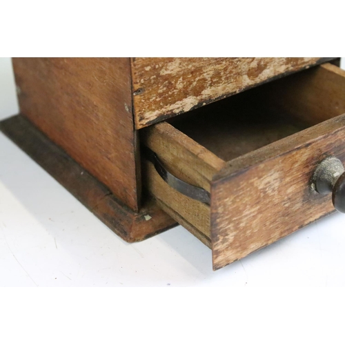 175 - An antique coffee grinder set within wooden case with lower coffee drawer.