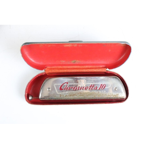 179 - A collection of four vintage Hohner harmonicas / mouth organs to include a Chrometta 14 example.