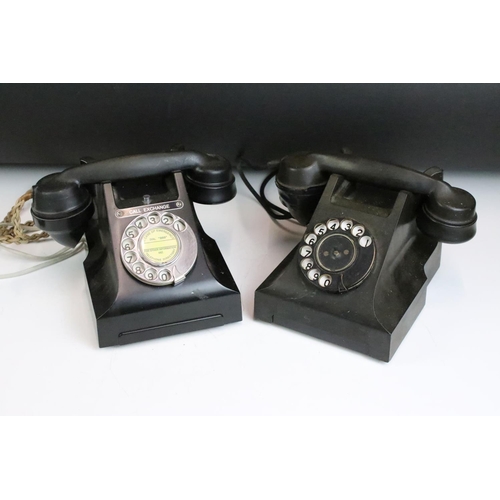 180 - Two early to mid 20th century black home telephones one labeled 'Call Exchange'.