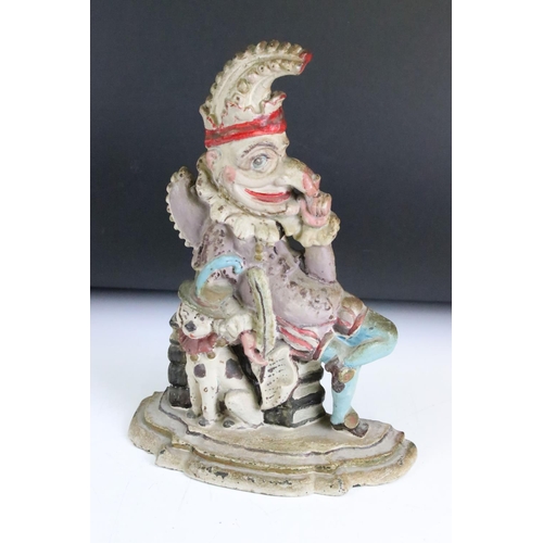 183 - Two Punch & Judy cast iron door stops to include a painted example.