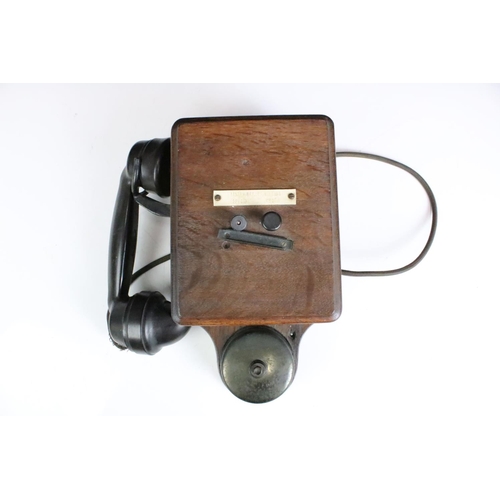 185 - An early 20th century Railways wooden cased wall hanging telephone.