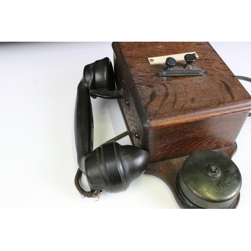 185 - An early 20th century Railways wooden cased wall hanging telephone.