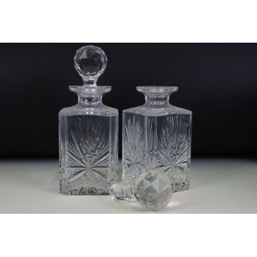 186 - Early 20th century Two Bottle Oak Tantalus with a pair of cut glass decanters.