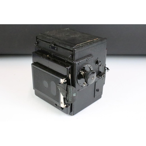 192 - A early to mid 20th century large format camera together with lens, filters...etc and stored within ... 