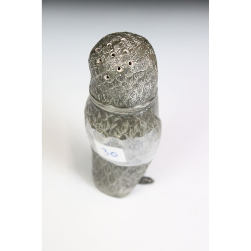 200 - An antique pewter pepper shaker in the form of an owl with glass eyes, stands approx 7.5cm in height... 