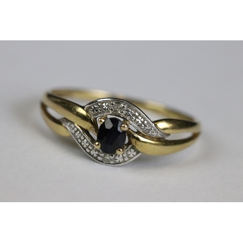 214 - A ladies 9ct gold and sapphire dress ring together with a yellow metal eternity ring.