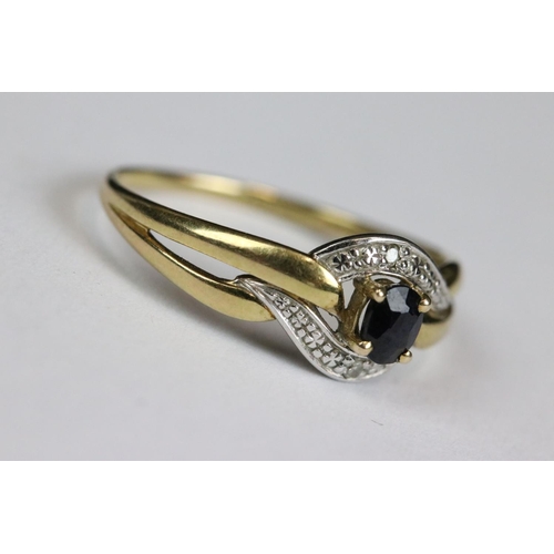 214 - A ladies 9ct gold and sapphire dress ring together with a yellow metal eternity ring.