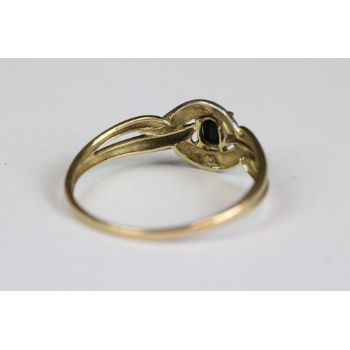 214 - A ladies 9ct gold and sapphire dress ring together with a yellow metal eternity ring.