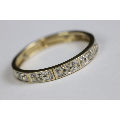 214 - A ladies 9ct gold and sapphire dress ring together with a yellow metal eternity ring.