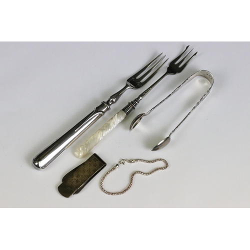 220 - A small collection of mixed sterling silver to include a money clip, sugar tongs and two forks one h... 