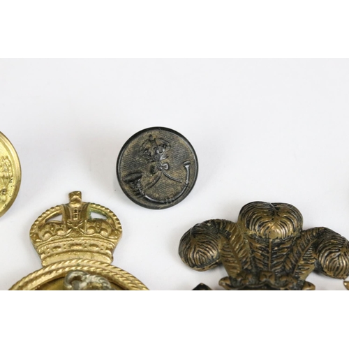 226 - A small collection of mainly military related badges and buttons.