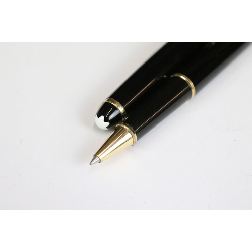 230 - A Mont Blanc rollerball pen together with two refills and pen holder.