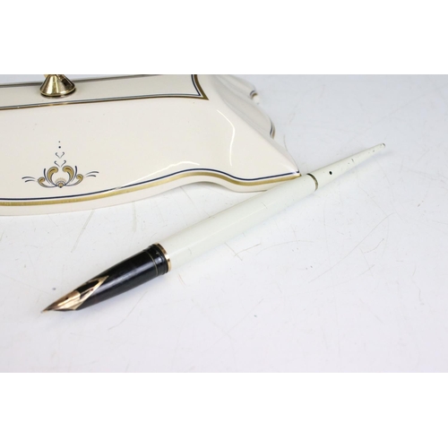 234 - A Sheaffer Special Limited Edition fountain pen with 14ct gold nib together with desk stand.