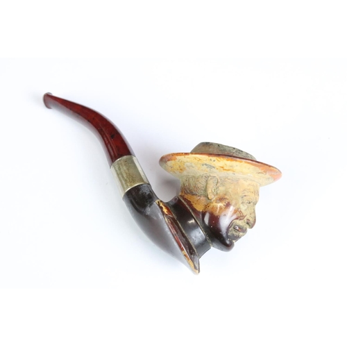 249 - An antique meerschaum pipe with the bowl carved as a gentleman wearing a hat, silver collar and orig... 