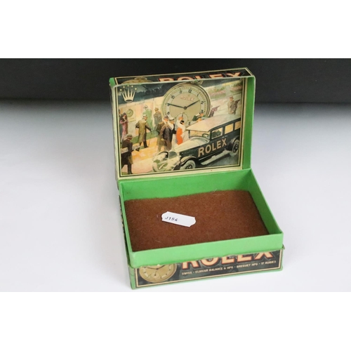 239 - A Rolex pocket watch box with advertising graphics to all sides.