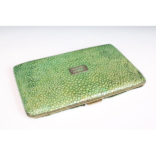 243 - An antique shagreen cigarette case together with three snuff / trinket boxes.