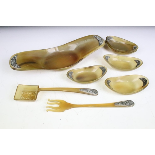 254 - A carved horn Caviar set with white metal embellishments.