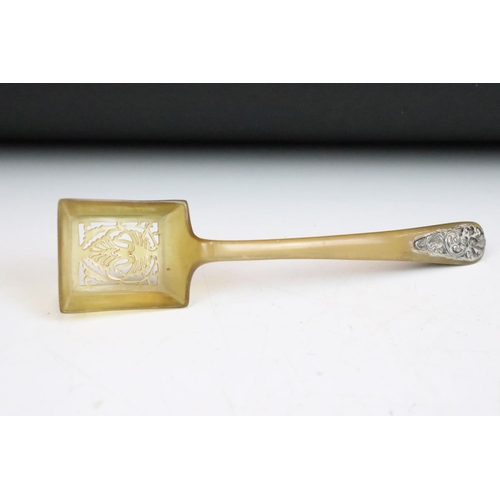 254 - A carved horn Caviar set with white metal embellishments.