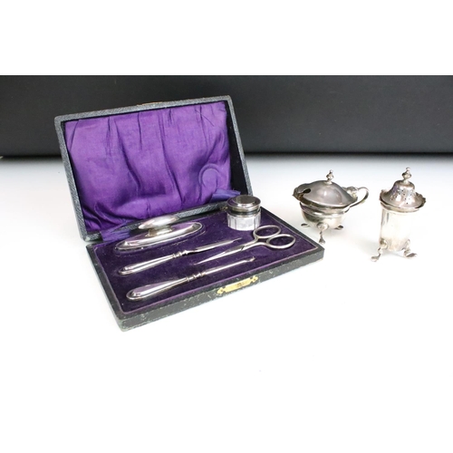 255 - A collection of fully hallmarked sterling silver collectables to include a mustard pot, pepper shake... 