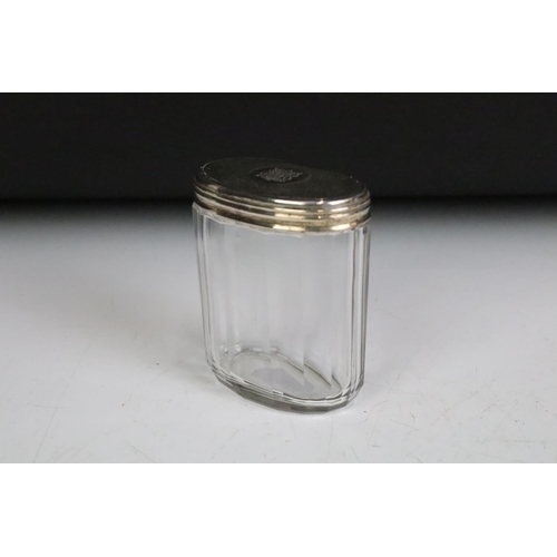 256 - A box of mixed vanity collectables to include fully hallmarked sterling silver topped jars.