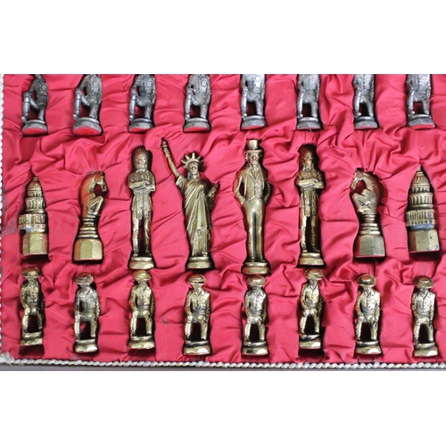 266 - A cased cast metal United States of America historical figures chess set