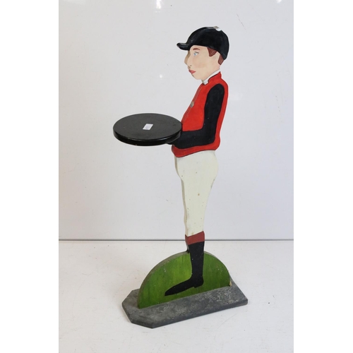 350 - A wooden dumb waiter in the form of a Jockey, stands approx 85cm in height.