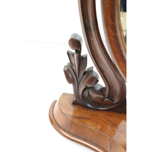 467 - Victorian Mahogany Oval Swing Dressing Mirror, held on carved supports and a shaped base with glove ... 