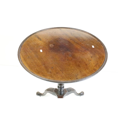 470 - George III Mahogany Circular Dish Top Table, raised on a turned pedestal support with three swept le... 