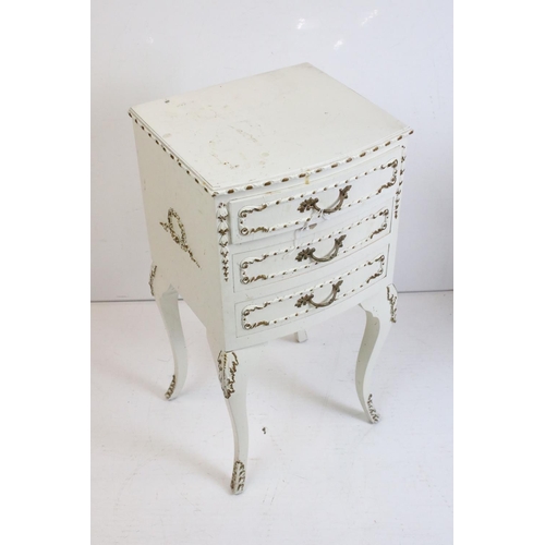 483 - Two French style Cream Painted Bedside Cabinets with moulded floral and foliate decoration, one with... 