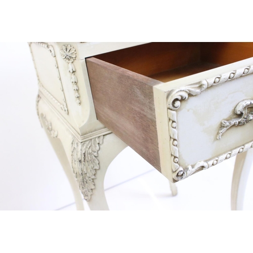 483 - Two French style Cream Painted Bedside Cabinets with moulded floral and foliate decoration, one with... 