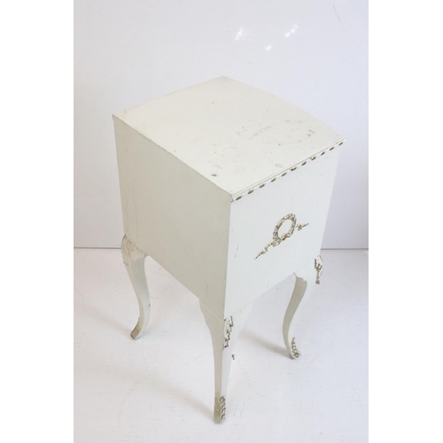 483 - Two French style Cream Painted Bedside Cabinets with moulded floral and foliate decoration, one with... 