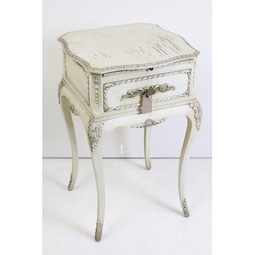 483 - Two French style Cream Painted Bedside Cabinets with moulded floral and foliate decoration, one with... 