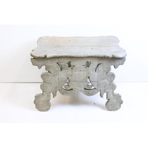 526 - Italianate Silver Painted Low Table with shaped top, raised on a base carved with lion masks, 76cm l... 