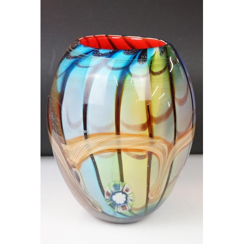 12 - Studio glass tapering vase with mottled rainbow swirl design within a clear glass casing (signed to ... 