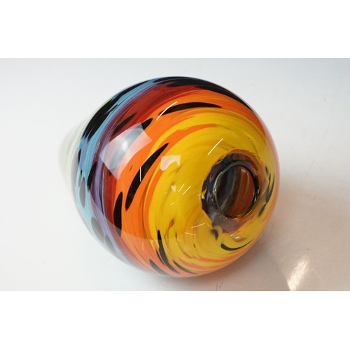 12 - Studio glass tapering vase with mottled rainbow swirl design within a clear glass casing (signed to ... 