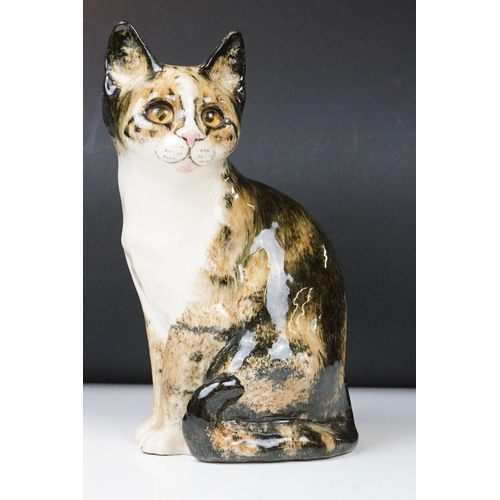 13 - Winstanley Pottery Seated Tabby Cat, with glass eyes, signed to base, measures approx 27.5cm high