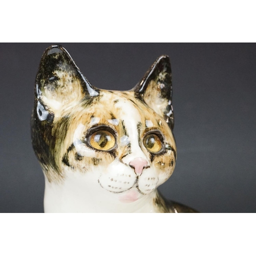 13 - Winstanley Pottery Seated Tabby Cat, with glass eyes, signed to base, measures approx 27.5cm high