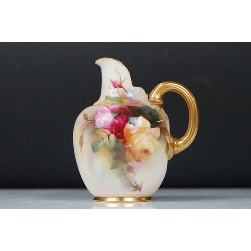 14 - Royal Worcester jug with hand painted Rose decoration, signed R Austin, gilt handle, date code for 1... 