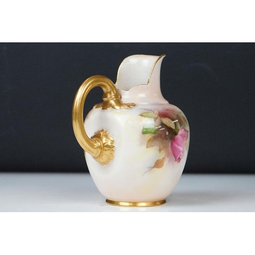 14 - Royal Worcester jug with hand painted Rose decoration, signed R Austin, gilt handle, date code for 1... 