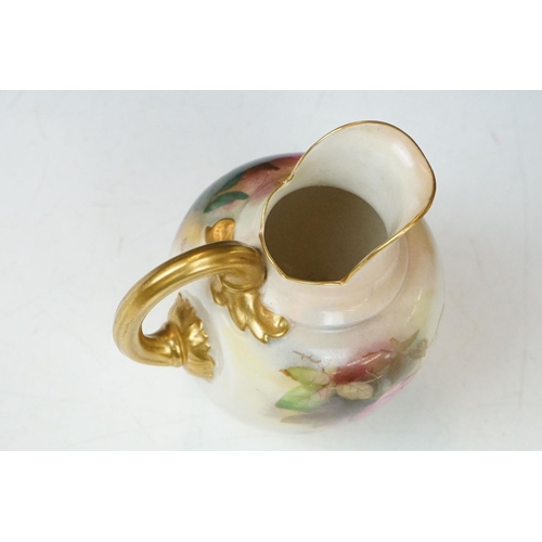 14 - Royal Worcester jug with hand painted Rose decoration, signed R Austin, gilt handle, date code for 1... 