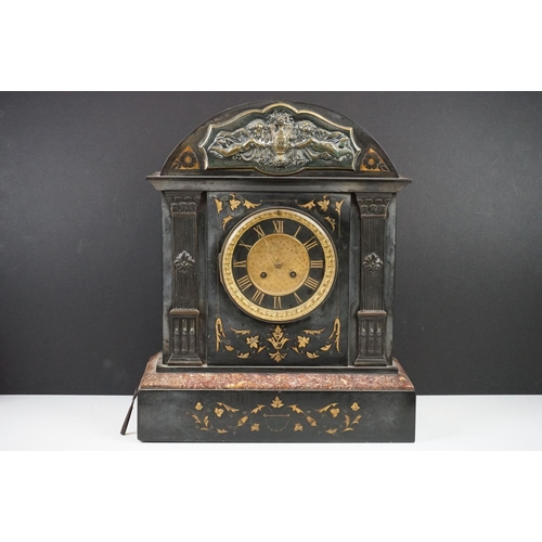 150 - Victorian black slate mantle clock of architectural form, with brass dial, the case with inlaid foli... 