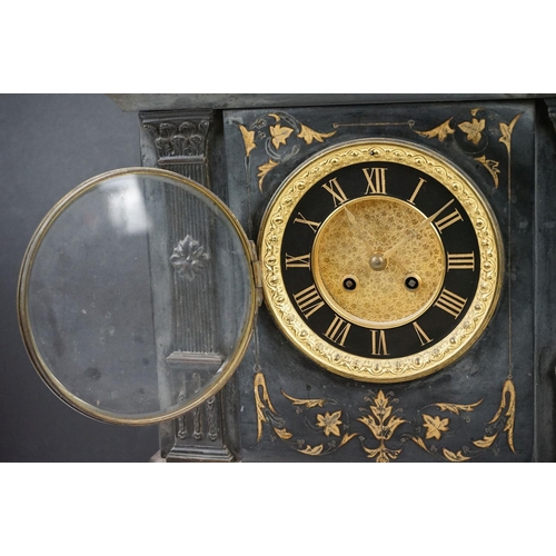 150 - Victorian black slate mantle clock of architectural form, with brass dial, the case with inlaid foli... 